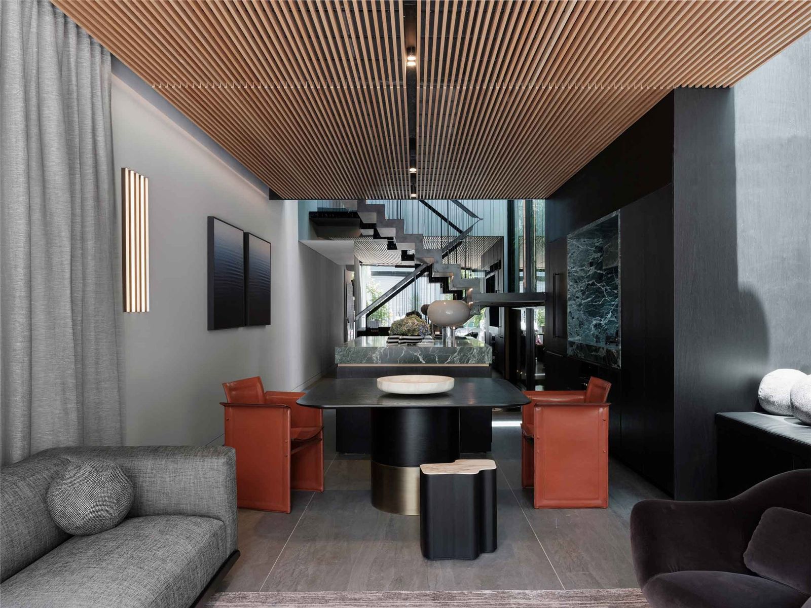 Interior with timber batten ceiling, green marble island and floating staircase