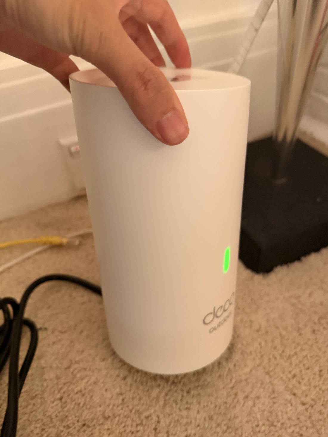 A TP-Link Deco node in place with a green status light