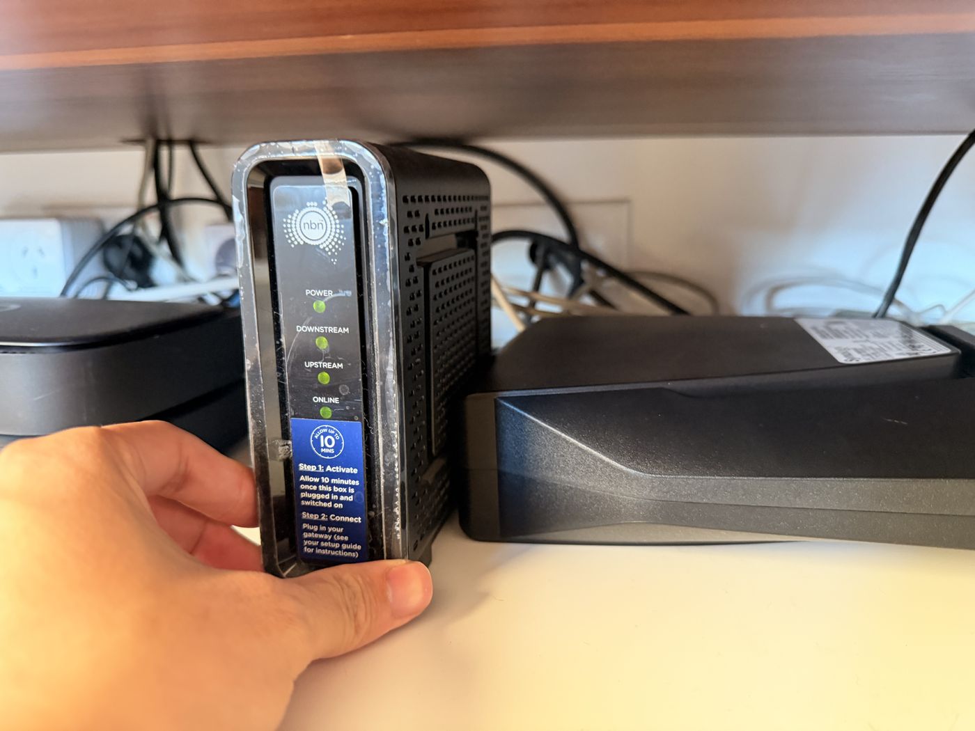 Engineer holding the NBN HFC connection box